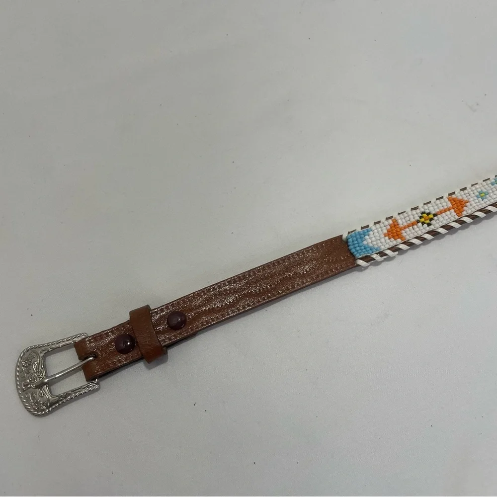 Child’s brown tribal beaded belt. Braided edge. Size 28. Pre-owned. Eagle. Arrow